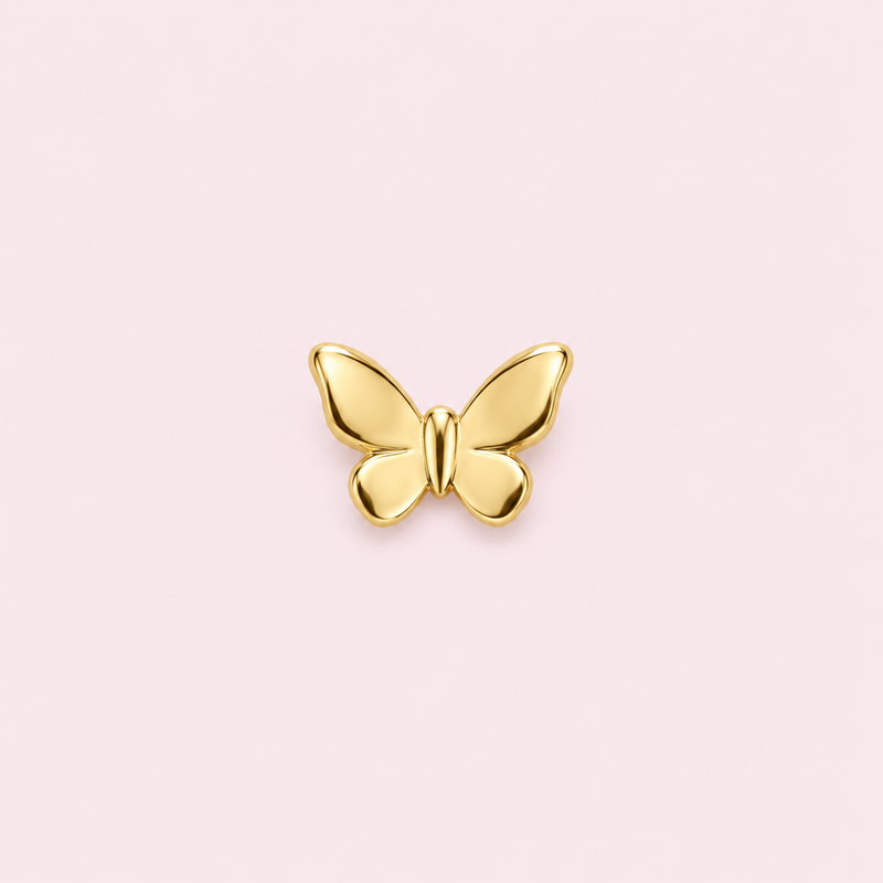 Bijou dentaire papillon doré